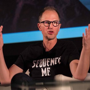 Bryce Olson speaking, in a Sequence Me shirt